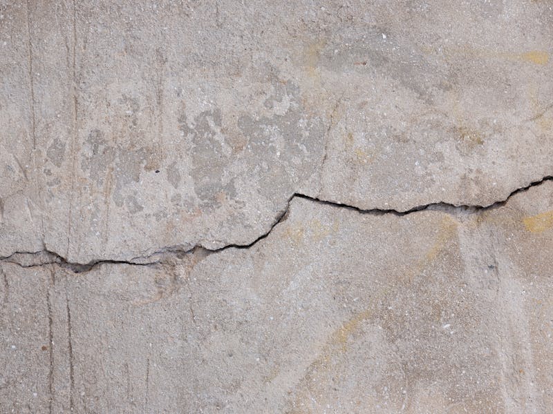 Crack filling and surface repair on a building wall